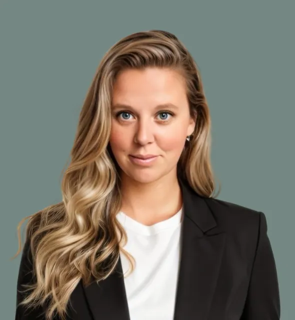 Professional portrait of a woman with blonde wavy hair, wearing a black blazer.